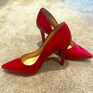 Red patent pumps